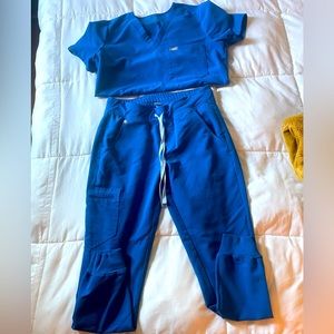 Size small women’s FIGS Technical collection scrub set. Bright blue color.